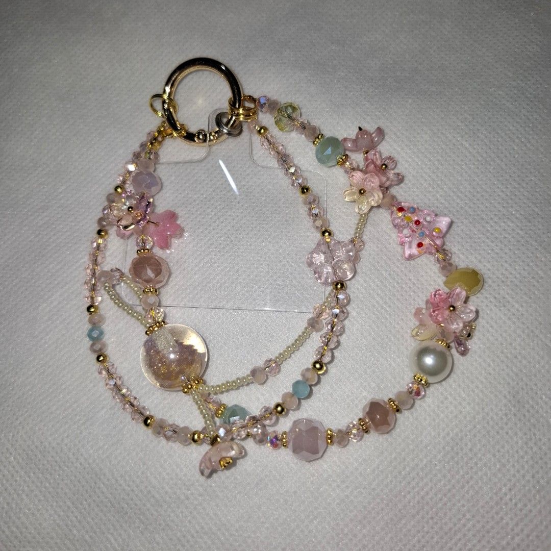 Handmade Beaded Phone Charms (Category: Other Mobile & Gadget Accessories) located in Manila. Submitted by mdc08 (Listing ID 1414381297, Image 2). Description: ‼️ NOW, FOR ONLY 250 EACH. GET 2 OR MORE FOR ONLY 200 EACH. ‼️ - Handmade phone / bag charms - Features colorful beads and charms - Unique designs with various color combinations - Includes decorative elements like flowers and butterflies - Comes with a gold or silver ring for easy phone /
