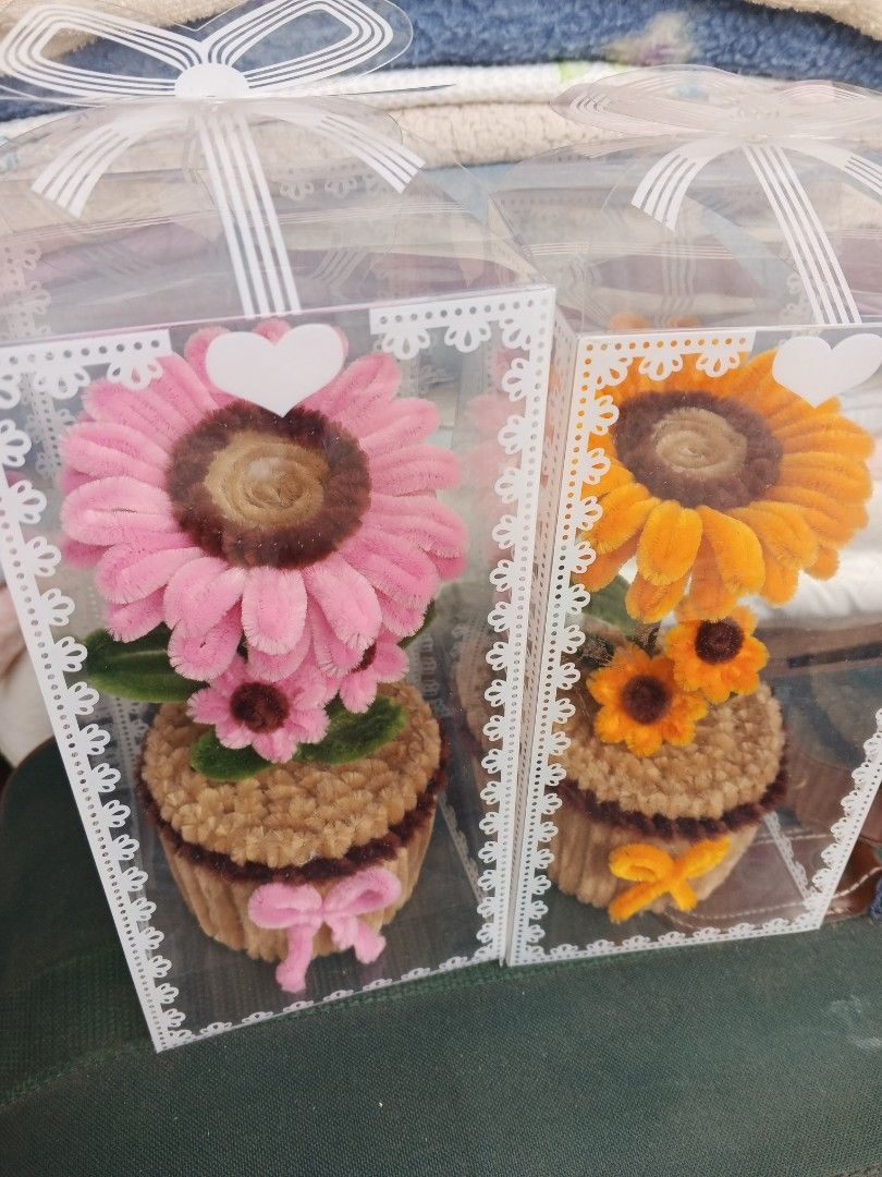 Handmade Flower in Box (Category: Flowers & Bouquets) located in Caloocan City. Submitted by surplusandbnewshop (Listing ID 1414253225, Image 3). Description: - Handmade flower - Presented in clear boxes - Available colors: Pink, Yellow, Purple - Unique cupcake-shaped base - Decorated with bows - Ideal for gifts and home decor.