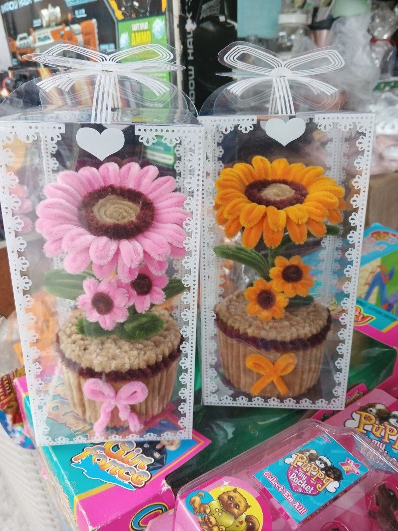 Handmade Flower in Box (Category: Flowers & Bouquets) located in Caloocan City. Submitted by surplusandbnewshop (Listing ID 1414253225, Image 1). Description: - Handmade flower - Presented in clear boxes - Available colors: Pink, Yellow, Purple - Unique cupcake-shaped base - Decorated with bows - Ideal for gifts and home decor.