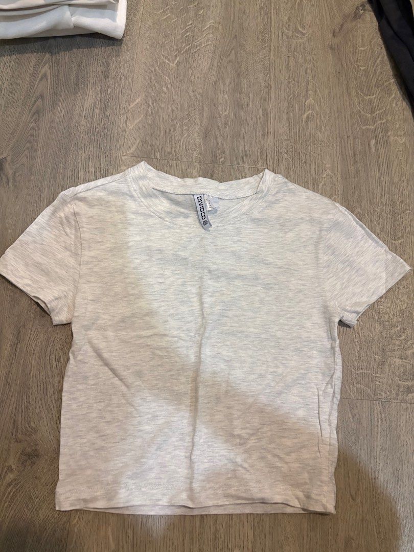 H&M Divided Crop Top - Grey (Category: Shirts) located in Singapore. Submitted by hoellister (Listing ID 1414385278, Image 1). Description: +$2 for postage.