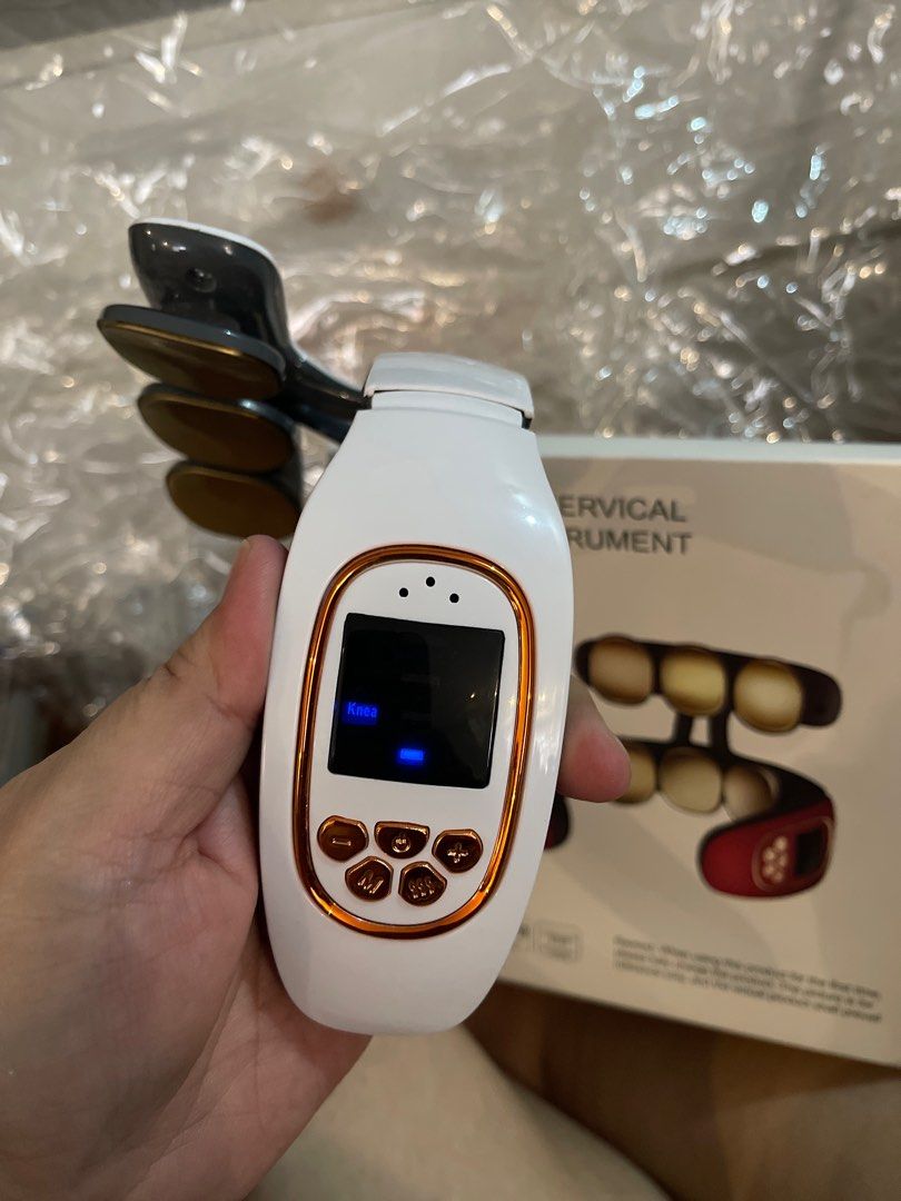 Intelligent Cervical Massage Instrument (Category: Massage Devices) located in Las Pinas. Submitted by frugalmama (Listing ID 1414313897, Image 2). Description: Intelligent Cervical Massage Instrument offers electrical pulse and hot compress modes. It is designed for neck and back pain relief. The device has an LCD screen and control buttons. It is recommended to fully charge the product before first use. The electrodes should be placed close to 