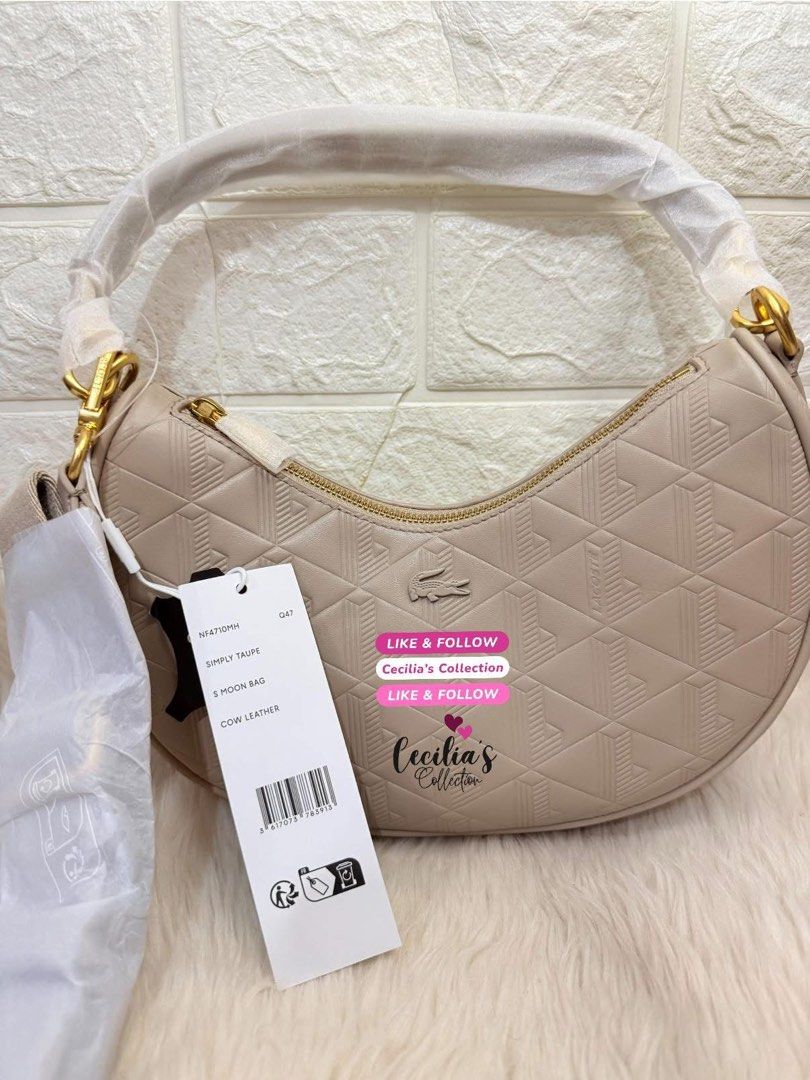 Lacoste Maheki Embossed Leather Half Moon Purse (Category: Shoulder Bags) located in Paranaque City. Submitted by ceciliascollection (Listing ID 1414255690, Image 1). Description: Lacoste Maheki Embossed Leather Half Moon Purse ❣️ON HAND & READY TO SHIP 💯Authentic from Lacoste Singapore 💰Mall Price ₱12,950.00 ✔️color: Simply Taupe ✔️brand new with tag ✔️with dust bag ✔️with paper bag Description: This elegant Maheki leather half-moon bag featur