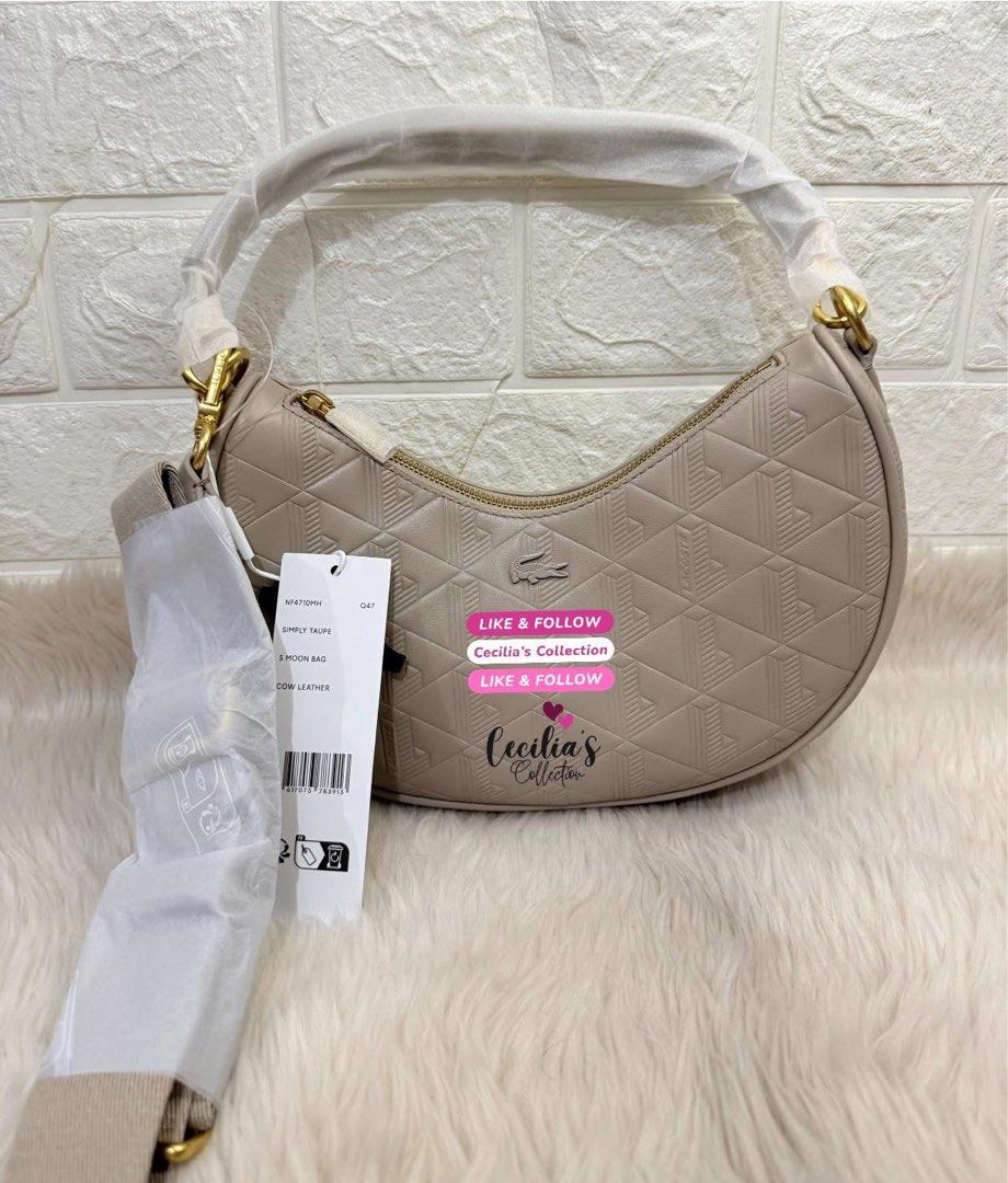 Lacoste Maheki Embossed Leather Half Moon Purse (Category: Shoulder Bags) located in Paranaque City. Submitted by ceciliascollection (Listing ID 1414255690, Image 2). Description: Lacoste Maheki Embossed Leather Half Moon Purse ❣️ON HAND & READY TO SHIP 💯Authentic from Lacoste Singapore 💰Mall Price ₱12,950.00 ✔️color: Simply Taupe ✔️brand new with tag ✔️with dust bag ✔️with paper bag Description: This elegant Maheki leather half-moon bag featur