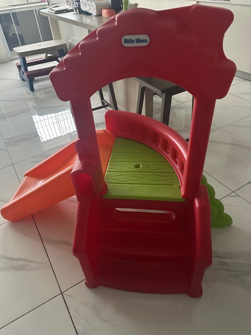 Little Tikes Slide (Category: Infant Playtime) located in San Juan City. Submitted by v7_cd (Listing ID 1414271246, Image 1). Description: - Little Tikes slide - Perfect for indoor or outdoor play - Features a red frame - Orange slide - Green platform - Gentle slope for safe sliding - Great for playrooms or backyards - Provides hours of entertainment.