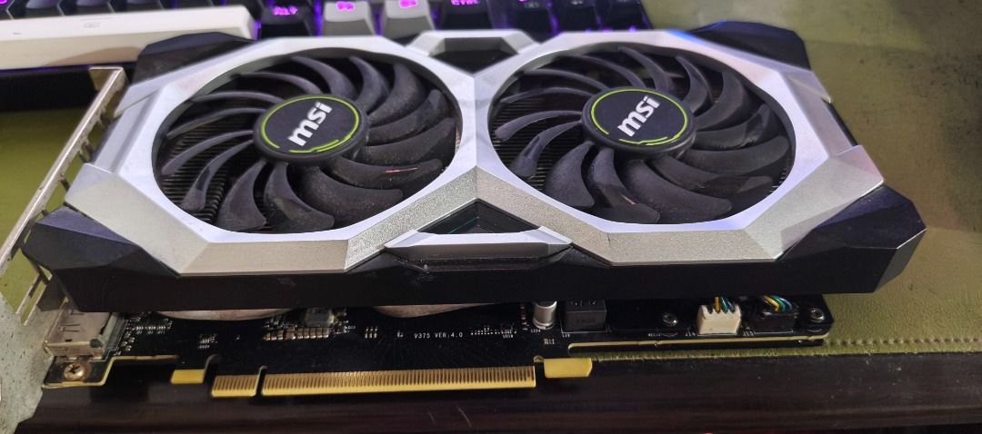 MSI GeForce RTX 2070 VENTUS 8G (Category: Computer Parts) located in Tacloban City. Submitted by joekap (Listing ID 1414352335, Image 1). Description: Deffective MSI GeForce RTX 2070 VENTUS 8G graphics card. Features dual fans for cooling. The serial number is 602-V375-965D2004001063. Includes a 3D7 check code. System unit power on but no display fan working, computer speaker working. Bigla bigla nalang di na nag display. For sale nalang. At may 