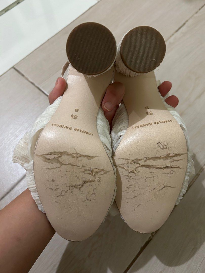 Pearl White Loeffler Randall Bow Sandals (Category: Flats & Sandals) located in Taguig. Submitted by _wardrobecleanse (Listing ID 1414270838, Image 3). Description: - Loeffler Randall sandals - Unique bow design - Cream color - Ankle straps - Size: 5.5 US - Signs of wear on soles - Adds sophistication to any outfit Used only once for my wedding.