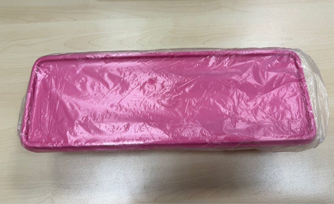 Pink Rectangular Tupperware (Category: Other Kitchenware & Tableware) located in Singapore. Submitted by sekyr (Listing ID 1414256502, Image 1). Description: Brand New Tupperware Container Dimensions are approximately 11cm x 30cm .