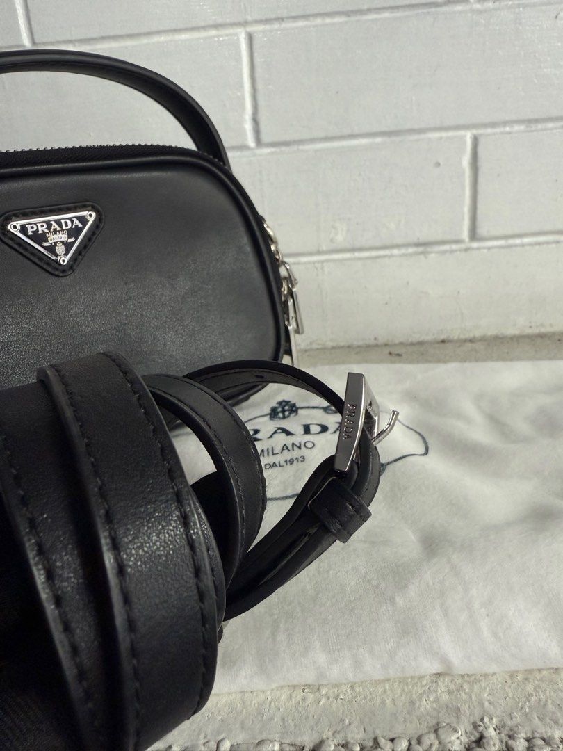 Prada (Category: Luxury Bags & Wallets) located in Baguio. Submitted by drein30 (Listing ID 1414343854, Image 3). Description: - Prada crossbody bag. - Elegant black color. - Includes a matching coin purse and belt. - Crafted with high-quality leather. - Features the iconic Prada logo. - Stylish and versatile design..