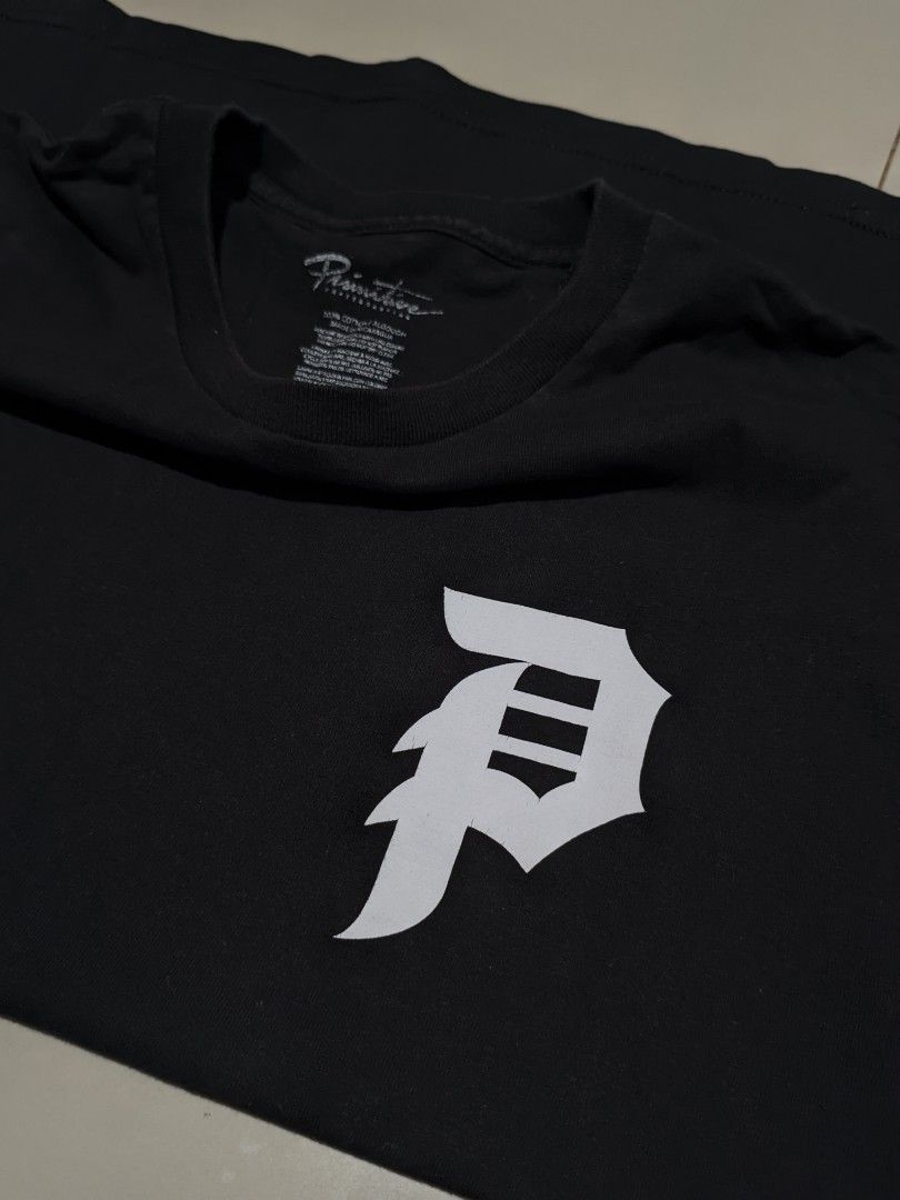 Primitive Dice Graphic Tee (Category: Tshirts & Polo Shirts ) located in Caloocan City. Submitted by wupeeram (Listing ID 1414397051, Image 3). Description: - Black Primitive t-shirt - Features a dice graphic on the back - Brand logo on the front - Crew neck and short sleeves - Measurements: L28, W20.5.