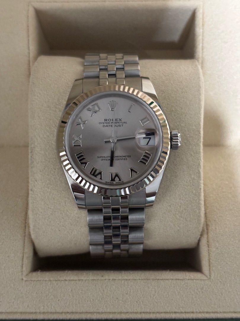 Rolex Datejust Silver Dial Stainless Steel (Category: Luxury Watches) located in Taguig. Submitted by coconat28 (Listing ID 1414301086, Image 1). Description: - Rolex Datejust - Silver dial - Stainless steel bracelet - Roman numeral hour markers - Date display at 3 o'clock - Includes original box and papers - Extra links included - Open to negotiation or swap/trade - Super flawless!.