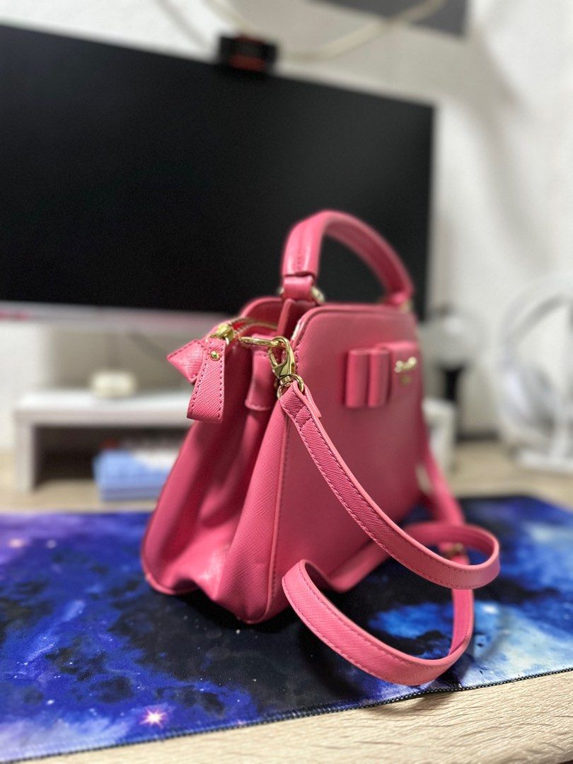 Samantha Vega Pink Handbag (Category: Luxury Bags & Wallets) located in Angeles City. Submitted by sjd_stuff (Listing ID 1414341093, Image 2). Description: - Samantha Vega handbag - Lovely pink color - Bow detail - Top handle - Detachable shoulder strap - Interior pocket with brand logo - Zipper closure - Gold-tone hardware.