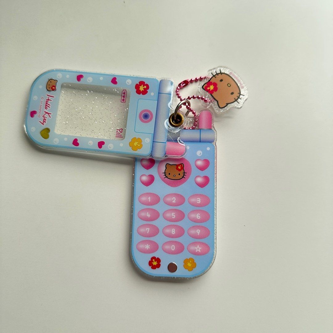 Sanrio | Tan Hello Kitty Flip Phone Acrylic ID Picture Holder Keychain (Category: Character Goods) located in Marikina City. Submitted by ilymiffy (Listing ID 1414258020, Image 3). Description: – Authentic Sanrio – Bought in Japan – Does not come with its plastic.