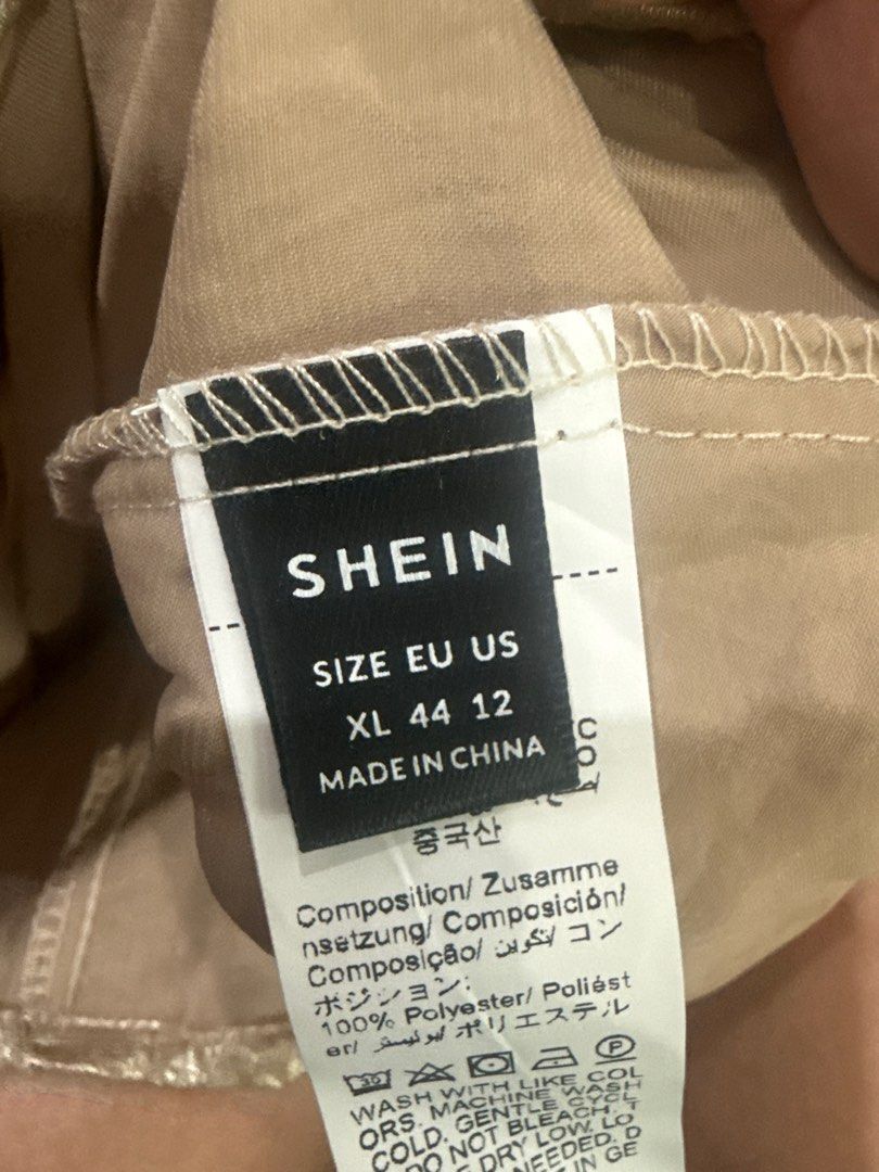 SHEIN Gold Dress XL (Category: Dresses) located in Mandaluyong City. Submitted by mjmc56 (Listing ID 1414267408, Image 2). Description: - SHEIN gold dress - Size: XL (EU 44, US 12) - V-neck design - Sleeveless - Flowing, loose fit - Slight sheen fabric - Shoulder detailing - Made in China.