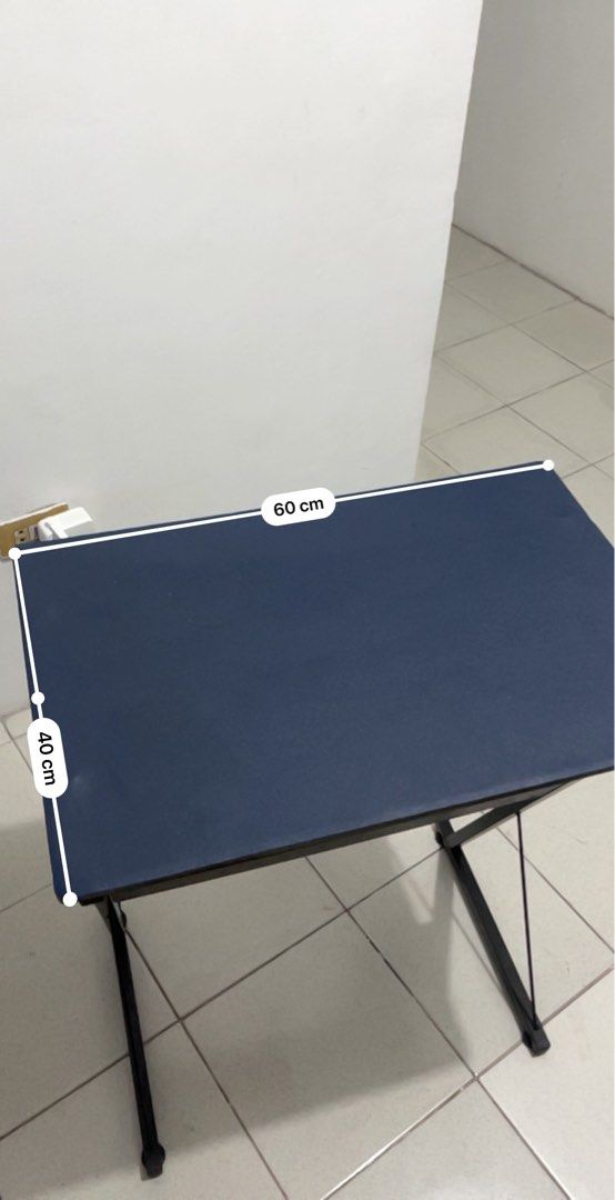 Small Study Table w/free desk mat installed (Category: Tables & Sets) located in Manila. Submitted by Yul_18 (Listing ID 1414377919, Image 1). Description: - Dark blue tabletop - Black metal frame - Dimensions: 60cm (Length) x 40cm (Width) x 85cm (Height) - Ideal for studying, working, or as a side table .