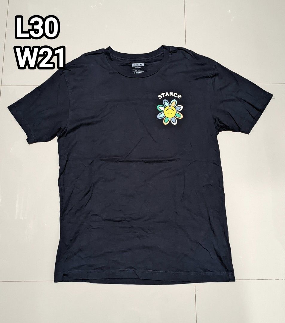 Stance Co. Flower Graphic Tee - Navy Blue (Category: Tshirts & Polo Shirts ) located in Caloocan City. Submitted by wupeeram (Listing ID 1414397961, Image 2). Description: - Navy blue Stance Co. t-shirt - Features a flower graphic on the front - Back graphic includes "Stance Co. Stitched Different" text - Crew neck and short sleeves - Measurements: L30 W21 - Material: 100% cotton.