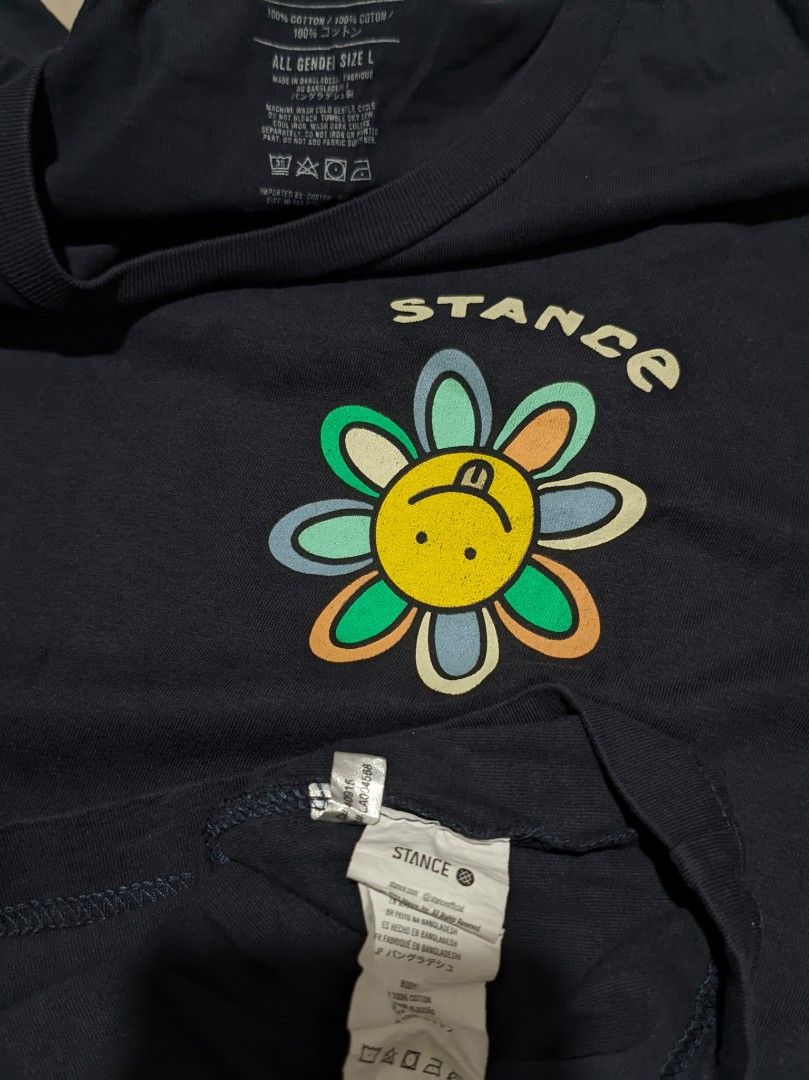 Stance Co. Flower Graphic Tee - Navy Blue (Category: Tshirts & Polo Shirts ) located in Caloocan City. Submitted by wupeeram (Listing ID 1414397961, Image 3). Description: - Navy blue Stance Co. t-shirt - Features a flower graphic on the front - Back graphic includes "Stance Co. Stitched Different" text - Crew neck and short sleeves - Measurements: L30 W21 - Material: 100% cotton.