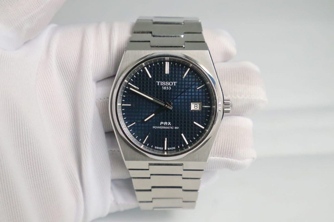 Tissot PRX Powermatic 80 Automatic Watch (Category: Luxury Watches) located in Cabanatuan. Submitted by albertgonzales27 (Listing ID 1414330158, Image 1). Description: - Tissot PRX Powermatic 80 - Blue dial with date display - Stainless steel case and bracelet - Transparent case back - Features the Tissot 1853 logo - Powermatic 80 movement - Crown on the right side.