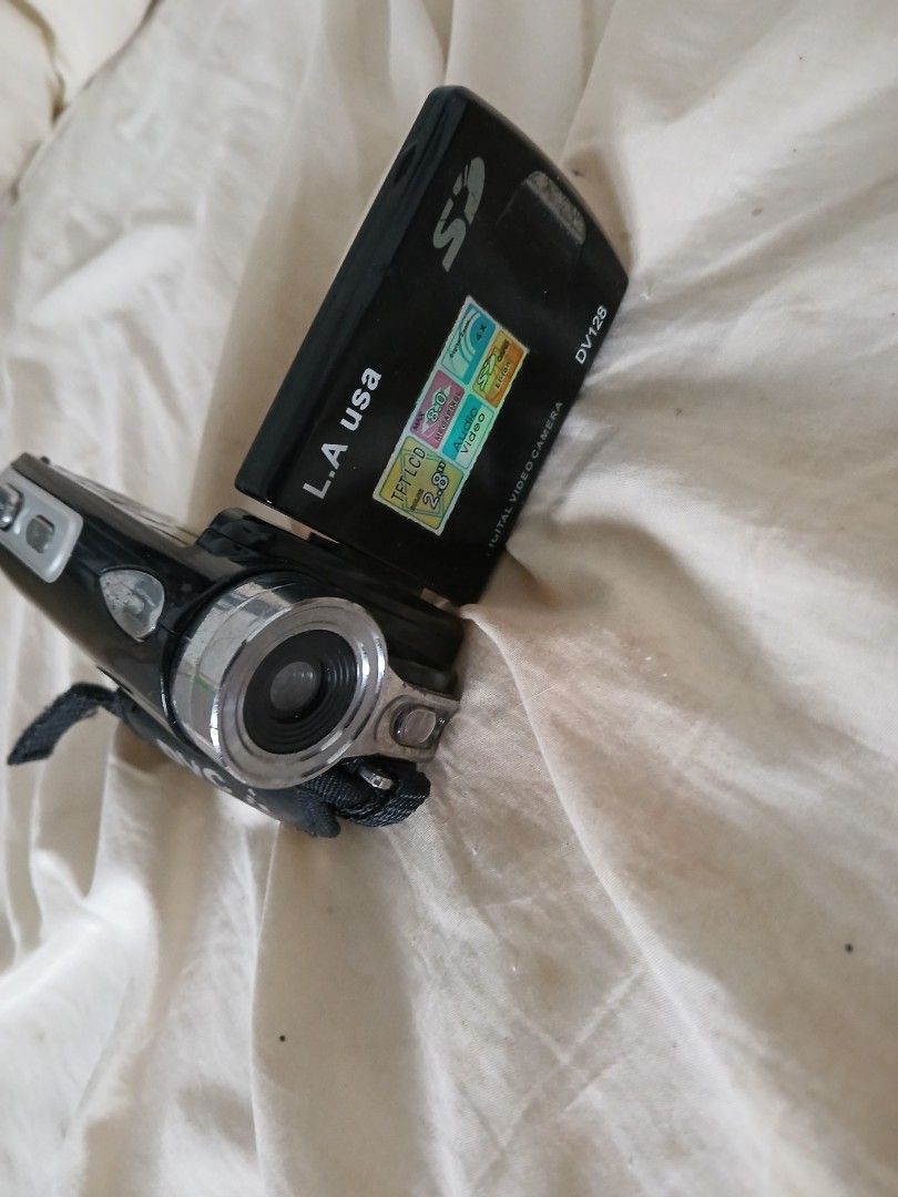 Untested/For Parts Digital Video Camera (Category: Video Cameras) located in Antipolo. Submitted by thisorthatarchives_ (Listing ID 1414293740, Image 1). Description: - Untested Black L.A. USA digital video camera - Built-in SD card slot - Includes hand strap As is.