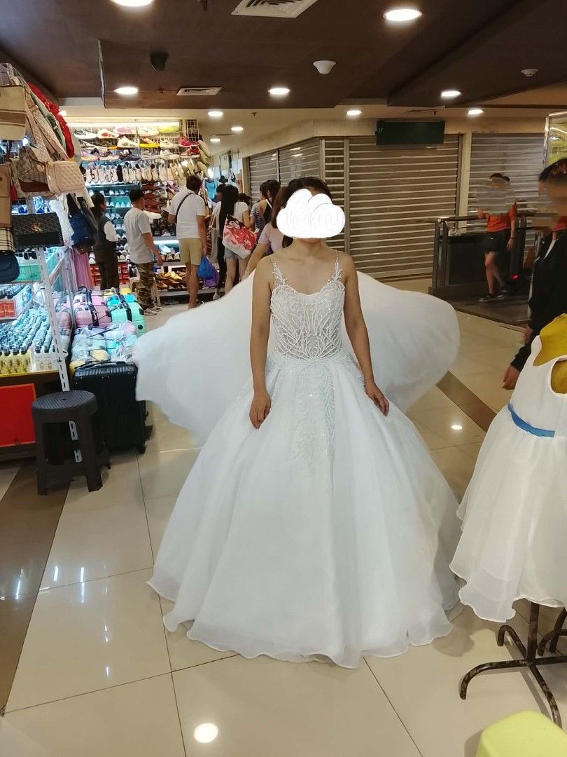 White Wedding Gown with Embellished Bodice (Category: Evening dresses & gowns) located in Taguig. Submitted by chicstyle (Listing ID 1414409439, Image 3). Description: ✨ For Sale ✨ Hello to all future brides! 👰🏻‍♀️ I'm selling my bridal gown if you might consider feel free to message me or just drop a comment here 🥰 Details: • Selling Price: P19,000 • Free Petticoat Included . Waistline 24-26 . Height 4'11 . Fits XS -Small . With side pockets 