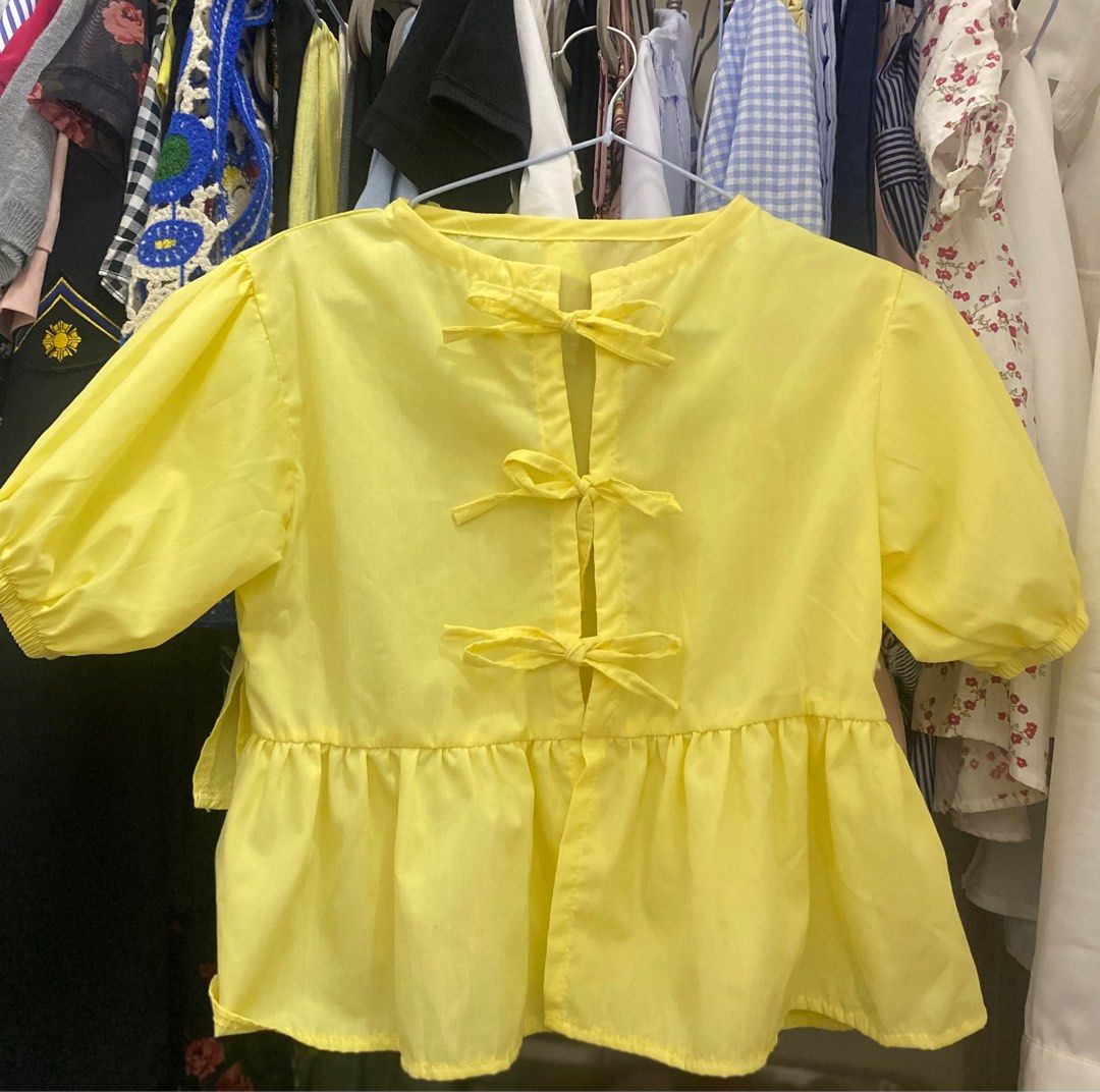 Yellow Bow Detail Top (Category: Blouses) located in Cagayan de Oro. Submitted by lhsphia (Listing ID 1414417379, Image 1). Description: Never worn Cute yellow top with bows Lightweight fabric .