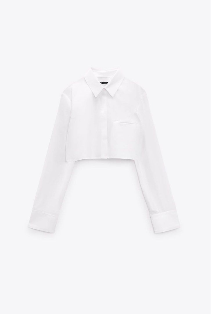 Zara Cropped White Shirt (Category: Shirts) located in Taguig. Submitted by deeclutter88 (Listing ID 1414368614, Image 2). Description: Zara white cropped shirt. Collared, long sleeves, buttoned cuffs, and two front pockets. Classic button-down style. Versatile..