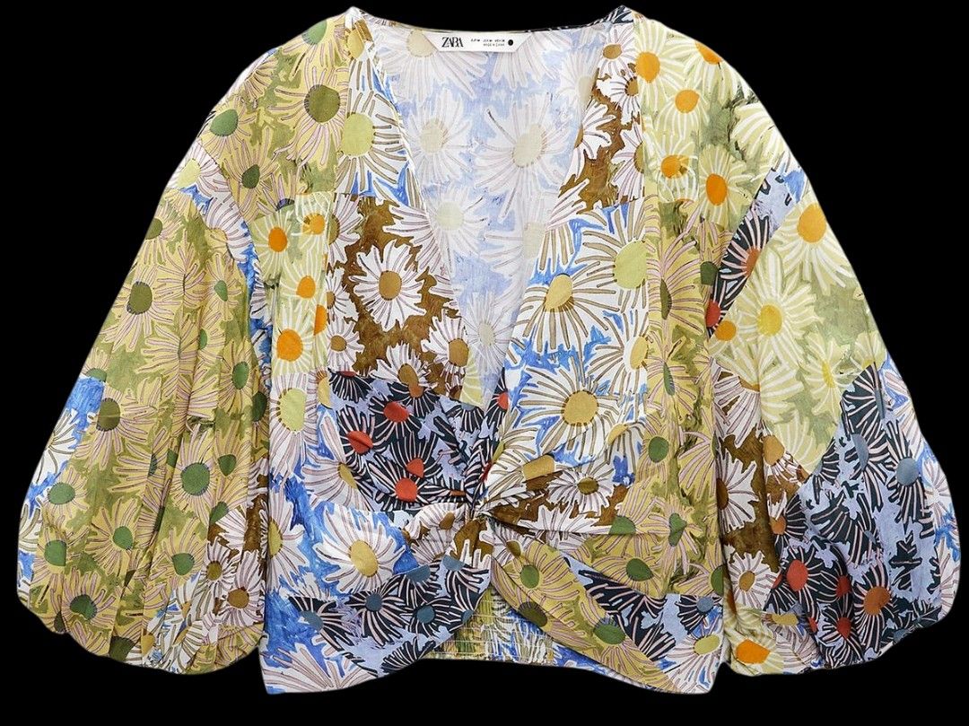 Zara Floral Print Blouse (Category: Blouses) located in Taguig. Submitted by deeclutter88 (Listing ID 1414369068, Image 1). Description: Zara floral blouse. Features a V-neck, puffy sleeves, and a cropped fit. Knot detail at the front and shirred elastic waistband at the back. Lightweight fabric..