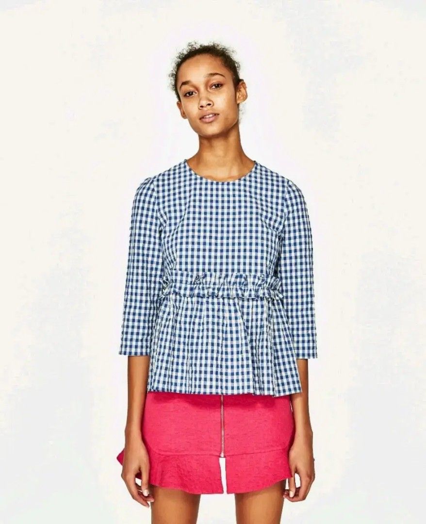 Zara Gingham Top (Category: Sleeveless) located in Taguig. Submitted by deeclutter88 (Listing ID 1414368188, Image 1). Description: Zara gingham top. Blue and white pattern. Three-quarter sleeves, gathered waist, and round neckline. Versatile style..