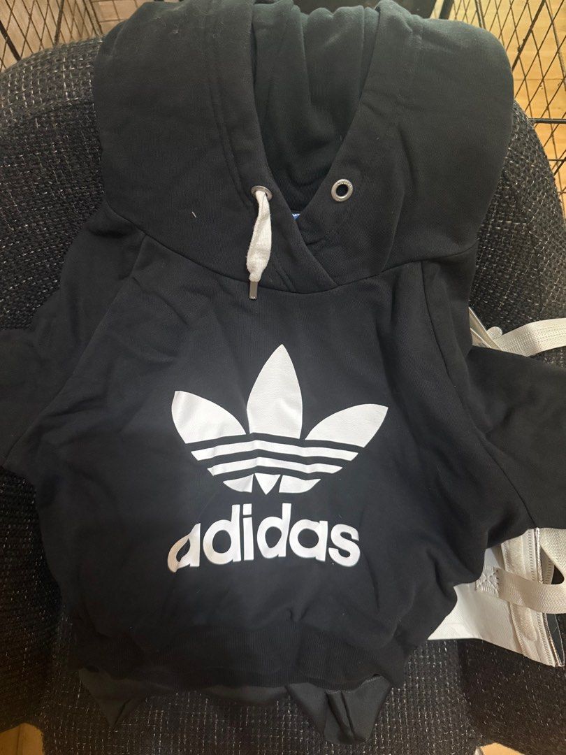 Adidas cropped Hoodie Black (Category: Coats, Jackets and Outerwear) located in Manila. Submitted by geecobra (Listing ID 1414509563, Image 1). Description: - Adidas hoodie - Iconic trefoil logo - Size: S - Features a hood and kangaroo pocket - Comfortable fabric - Perfect for casual wear.