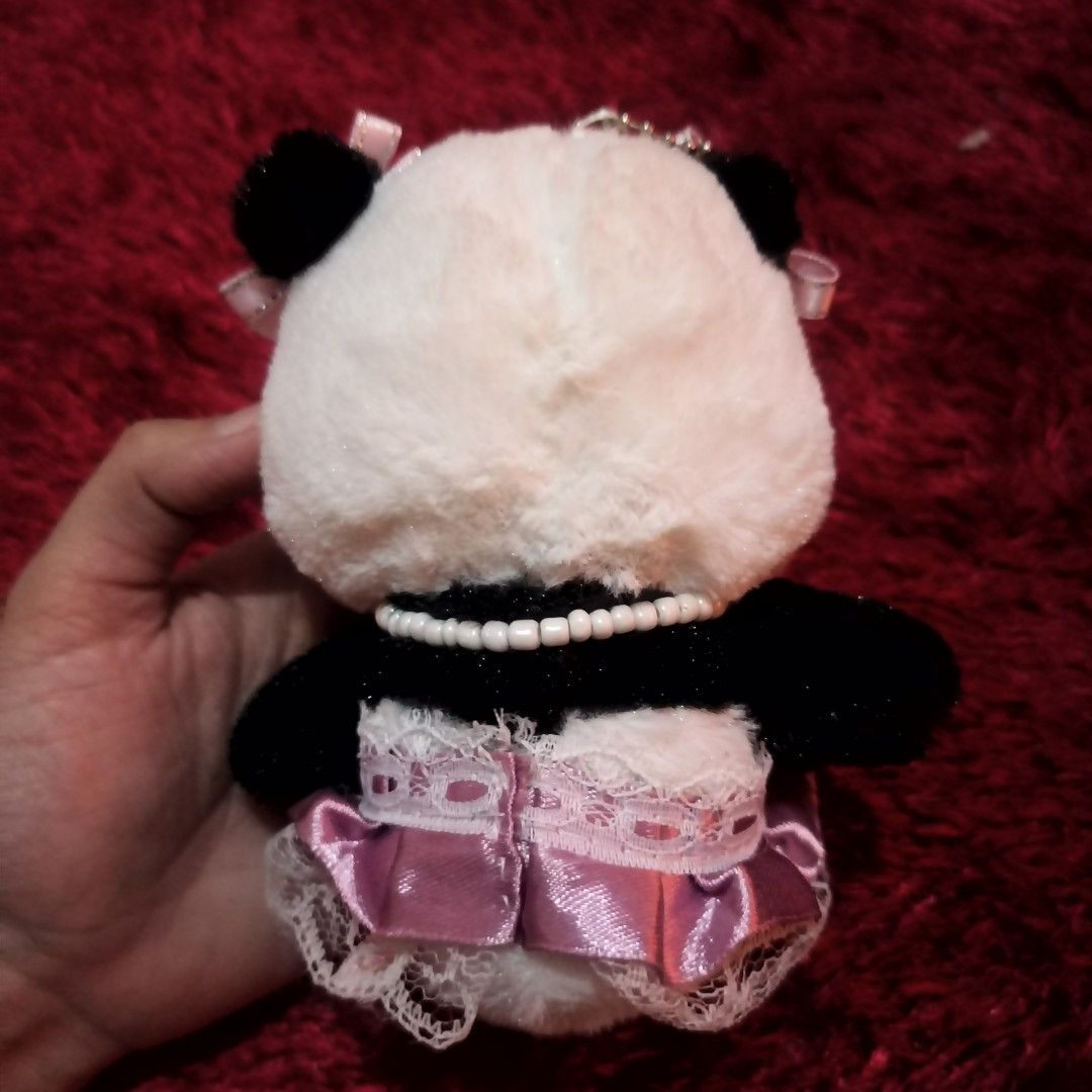 AMUSE Panda Plush Stuffed Toy Keychain Charm [ Customized ] (Category: Plushies & Soft Toys) located in Taguig. Submitted by oddlykawaiishop.ph (Listing ID 1414617317, Image 3). Description: 🎀 What you see is what you get—please check photos for details! •Sewn dress (removable), glued hairbows, and customized necklace! All yours! • Might need a light wash since it has been stored in a cabinet.