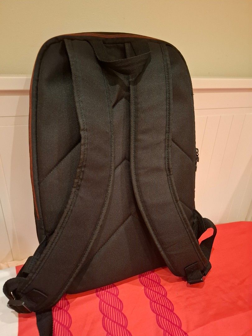 ASUS Laptop Backpack (Category: Backpacks) located in Manila. Submitted by warmcat-ee9368 (Listing ID 1414579641, Image 2). Description: - Black ASUS laptop backpack - Red accent line - Padded back for comfort - Adjustable shoulder straps - Double zipper closure - Made of durable fabric - Perfect for laptops and essentials.