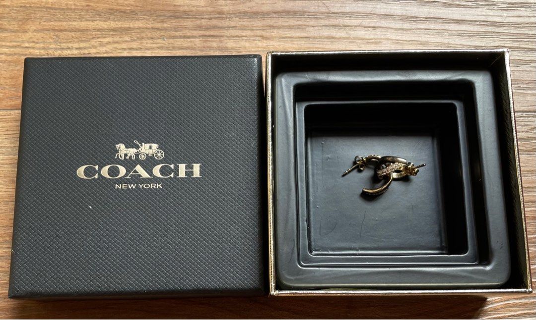 Authentic Coach Gold Earrings with Crystals (Category: Earrings) located in Quezon City. Submitted by sterling_grace (Listing ID 1414481562, Image 2). Description: - Coach earrings - Gold-tone finish - Sparkling crystals - Includes original Coach box - Unique curved design - Adds glamour - Great gift idea.