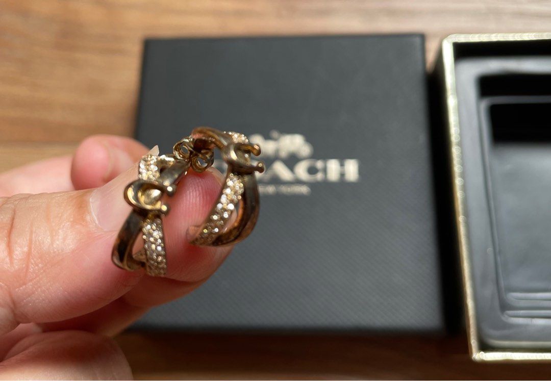 Authentic Coach Gold Earrings with Crystals (Category: Earrings) located in Quezon City. Submitted by sterling_grace (Listing ID 1414481562, Image 1). Description: - Coach earrings - Gold-tone finish - Sparkling crystals - Includes original Coach box - Unique curved design - Adds glamour - Great gift idea.