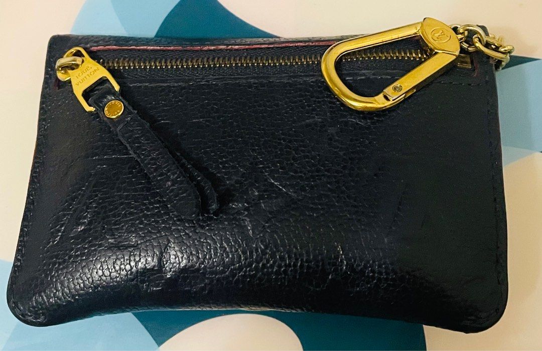 Authentic Louis Vuitton Monogram Empreinte Key Pouch (Category: Luxury Bags & Wallets) located in Quezon City. Submitted by sterling_grace (Listing ID 1414460087, Image 2). Description: Louis Vuitton Key Pouch in navy blue Monogram Empreinte leather with a gold-tone snap and chain.