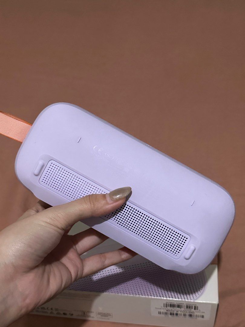 Bose SoundLink Flex Limited Edition Speaker (Category: Soundbars, Speakers & Amplifiers) located in Manila. Submitted by roannesama46969 (Listing ID 1414554282, Image 3). Description: - Bose SoundLink Flex Limited Edition speaker - Color: Lavender with orange strap - Features volume controls and power button - Includes original box -paper bag.