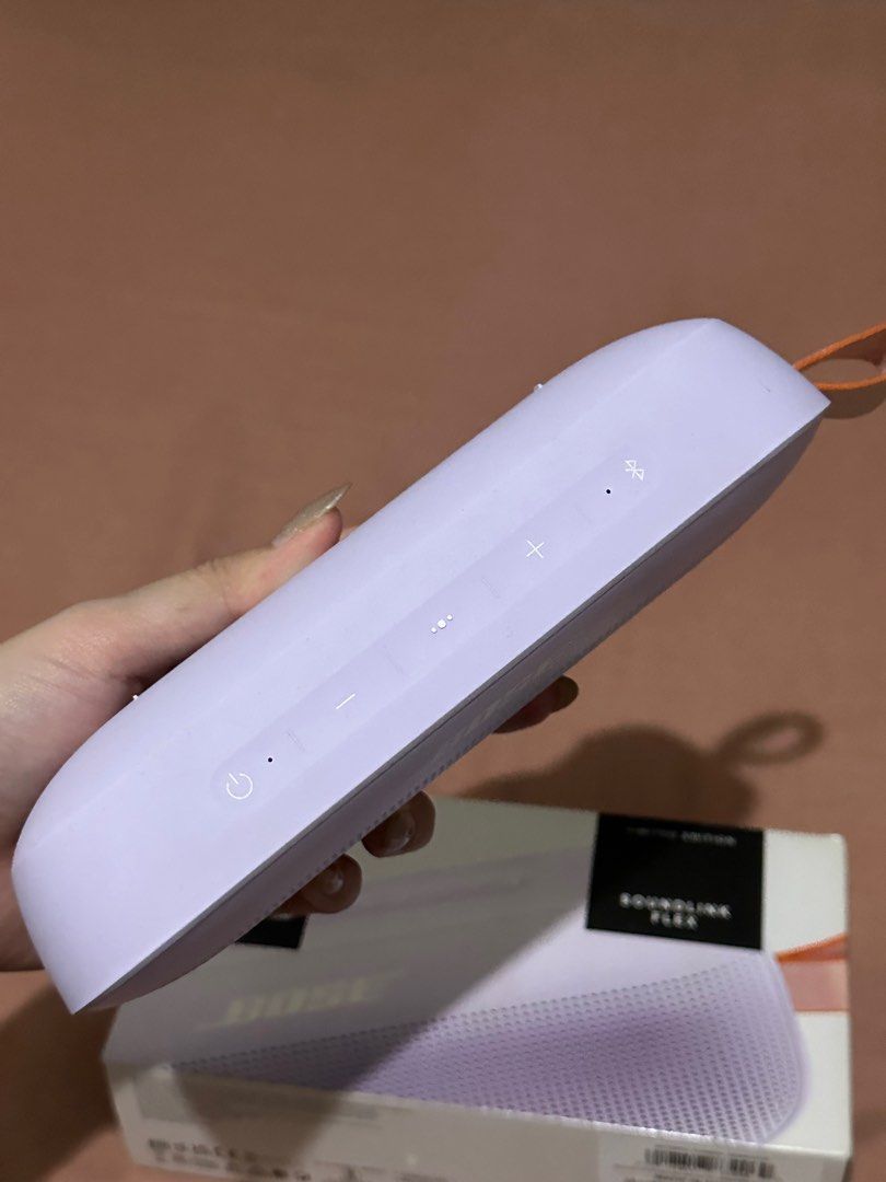 Bose SoundLink Flex Limited Edition Speaker (Category: Soundbars, Speakers & Amplifiers) located in Manila. Submitted by roannesama46969 (Listing ID 1414554282, Image 2). Description: - Bose SoundLink Flex Limited Edition speaker - Color: Lavender with orange strap - Features volume controls and power button - Includes original box -paper bag.