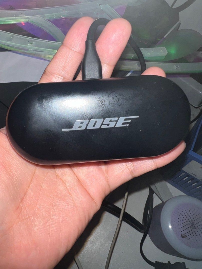 Bose Wireless Earbuds with Charging Case (Category: Earphones) located in San Jose del Monte. Submitted by loved.bags (Listing ID 1414524800, Image 2). Description: Bose wireless earbuds with a charging case. The case has a USB-C port for charging. The earbuds are black and have the Bose logo. The charging case also has a light indicator. The model number is visible on the bottom of the case. Includes the charging case and earbuds. complete with 
