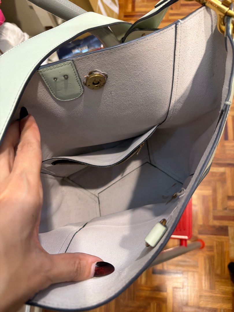 Rush sale Celine Bucket Bag (Category: Luxury Bags & Wallets) located in Quezon City. Submitted by branded_closet01 (Listing ID 1414591077, Image 3). Description: - Celine bucket bag - Light green color - Made of leather - Spacious interior with multiple pockets - Includes shoulder strap - Magnetic closure - Celine logo visible inside RUSH SALE .