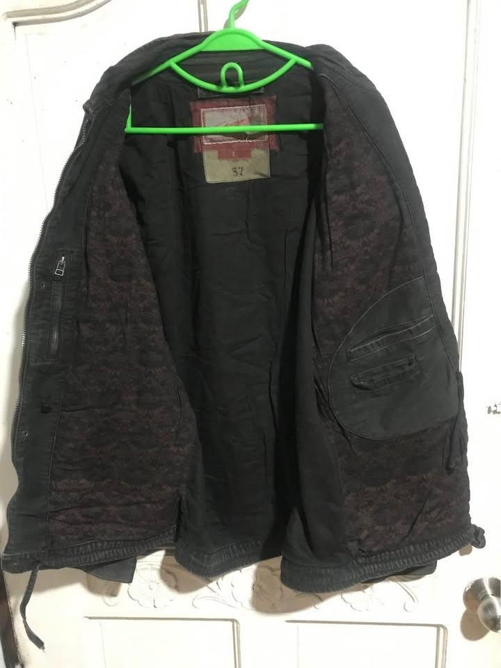 Vintage Chevignon Jacket - Size Large (Category: Coats, Jackets and Outerwear) located in Dasmarinas. Submitted by shuranotoki (Listing ID 1414462561, Image 3). Description: - Chevignon jacket in size L - Dark color with brown leather accents - Features leather accents on pockets and sleeves - Multiple pockets for storage - Full zipper closure - Drawstring waist for adjustable fit - Quilted lining for warmth and comfort - Chevignon brand logo on 