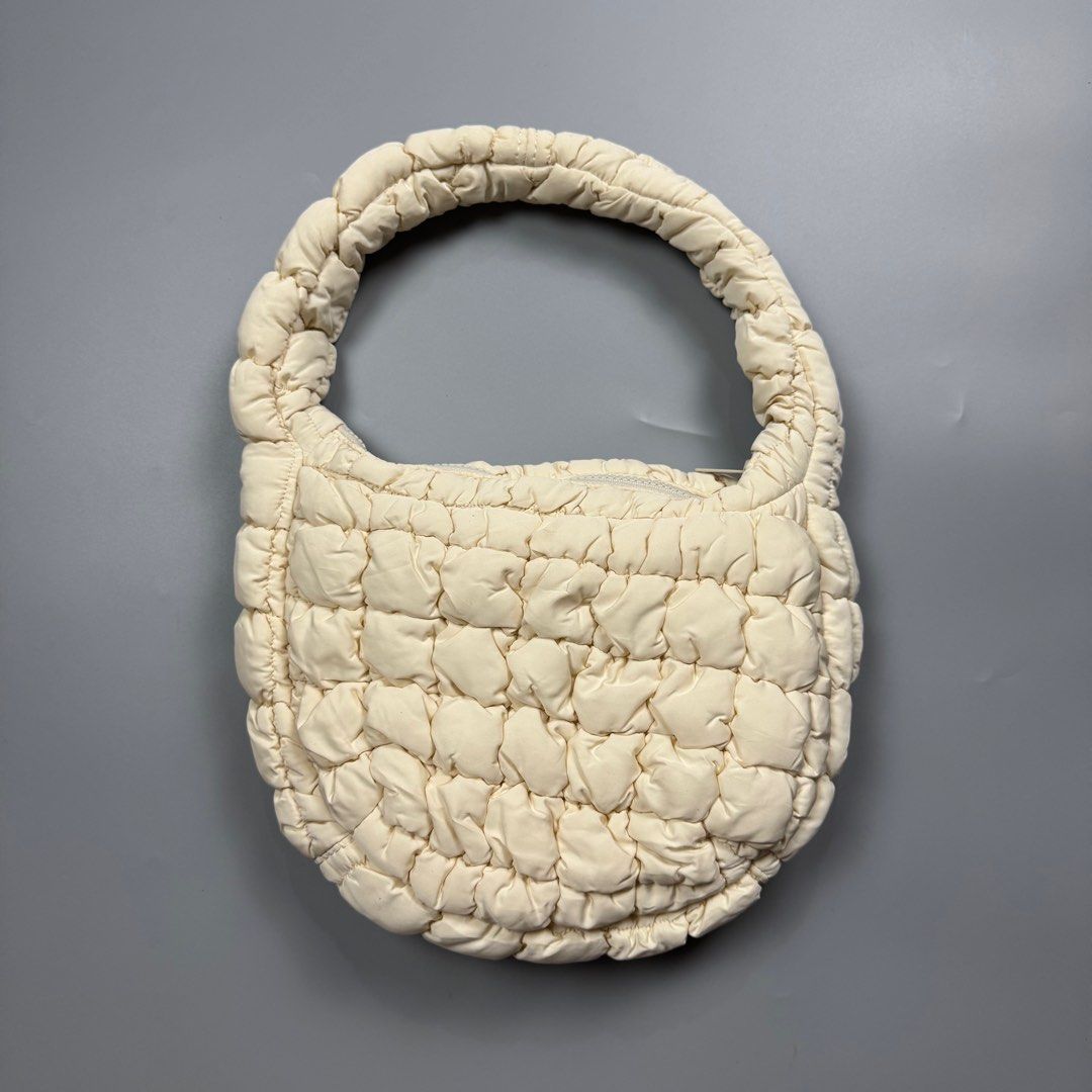 COS Padded /Quilted Mini Bag White/Cream (Category: Luxury Bags & Wallets) located in Baguio. Submitted by stockedclothing047 (Listing ID 1414554866, Image 2). Description: COS QUILTED MINI BAG (EXCELLENT CONDITION- COS cream-colored bag - Padded handle - Quilted design - Zipper closure - One size - Made in China.