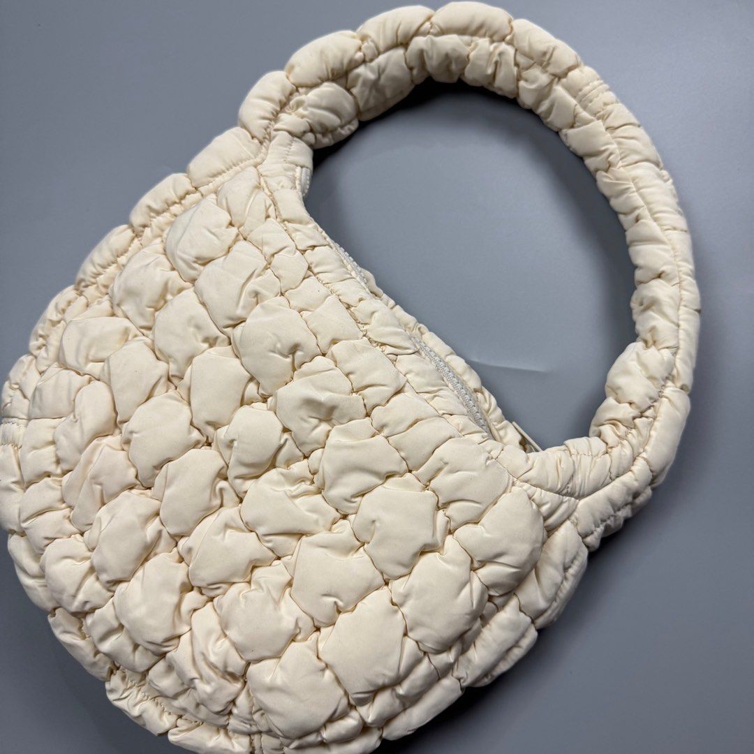 COS Padded /Quilted Mini Bag White/Cream (Category: Luxury Bags & Wallets) located in Baguio. Submitted by stockedclothing047 (Listing ID 1414554866, Image 3). Description: COS QUILTED MINI BAG (EXCELLENT CONDITION- COS cream-colored bag - Padded handle - Quilted design - Zipper closure - One size - Made in China.
