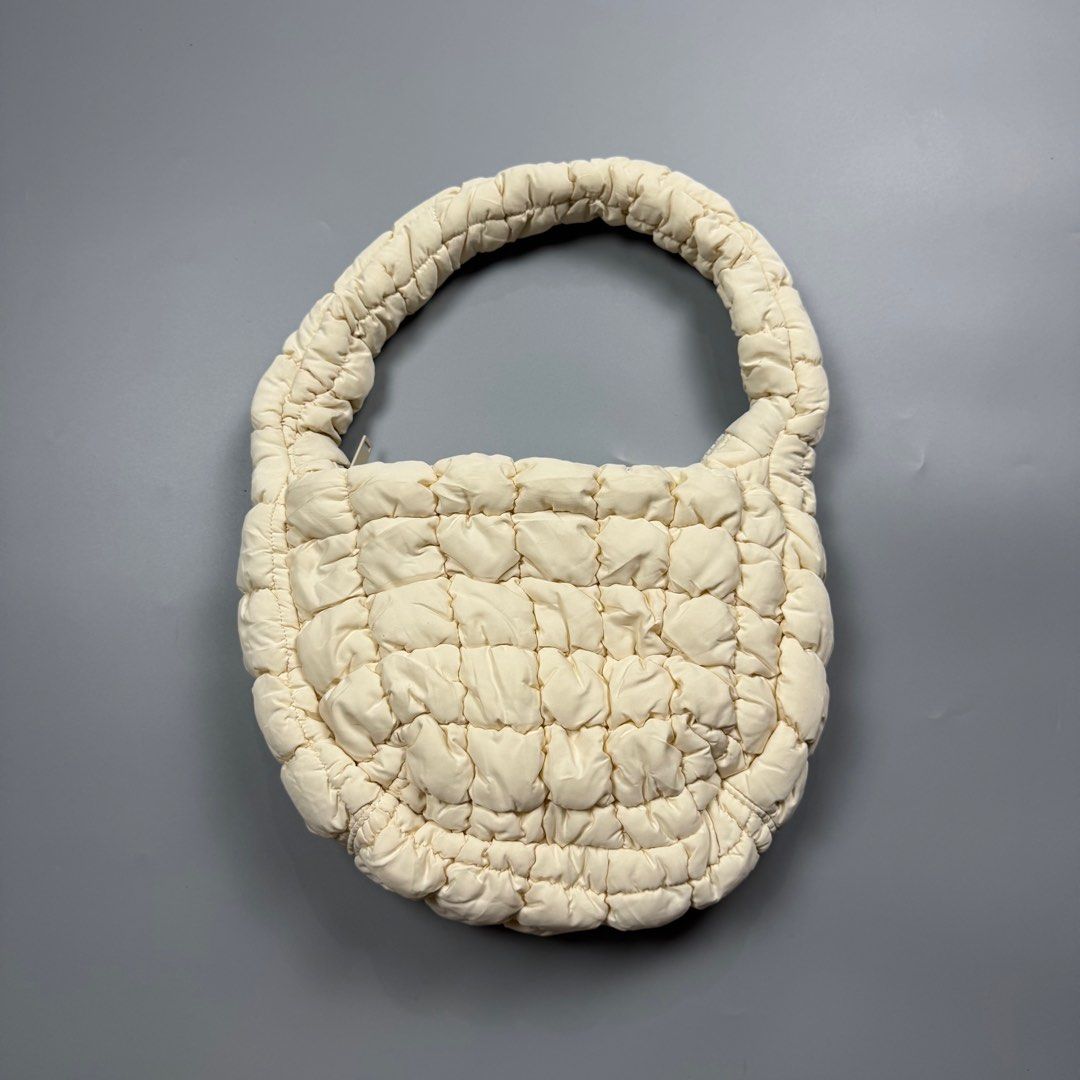 COS Padded /Quilted Mini Bag White/Cream (Category: Luxury Bags & Wallets) located in Baguio. Submitted by stockedclothing047 (Listing ID 1414554866, Image 1). Description: COS QUILTED MINI BAG (EXCELLENT CONDITION- COS cream-colored bag - Padded handle - Quilted design - Zipper closure - One size - Made in China.