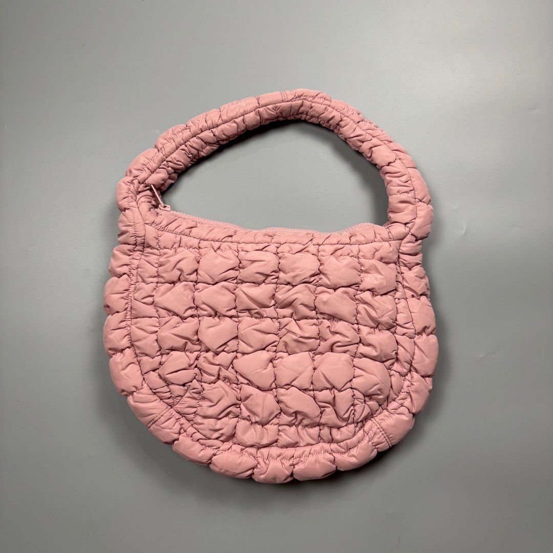 COS Padded/Quilted Mini Bag Pink (Category: Luxury Bags & Wallets) located in Baguio. Submitted by stockedclothing047 (Listing ID 1414554994, Image 1). Description: COS QUILTED MINI BAG (EXCELLENT CONDITION - COS mini bag - Light pink color - Quilted design - Top handle - Zip closure - Soft, padded texture - One size - Made in China.