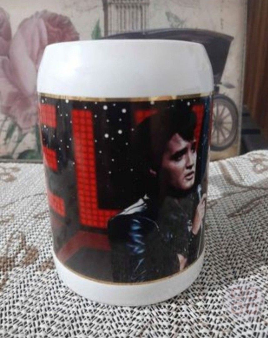 Elvis Presley Collectors Stein Mug (Category: Coffee & Tea Tableware) located in Santa Rosa. Submitted by ysaqui (Listing ID 1414474096, Image 2). Description: - Elvis Presley commemorative stein mug - Features Elvis image - Includes "Still The King Series 1968 Comeback Special" text - Produced by ISCUR - Made in Thailand - Gold trim.