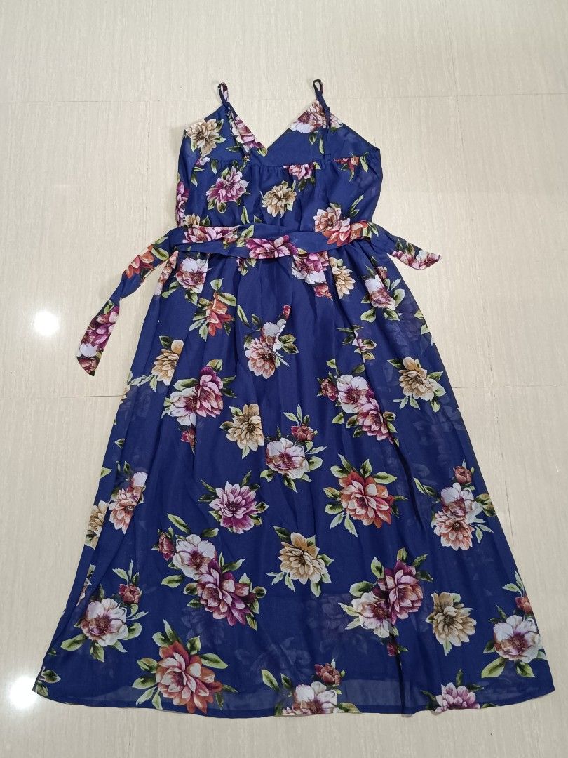 Floral Navy Blue Maxi Dress (Category: Dresses) located in Los Banos. Submitted by issay1 (Listing ID 1414541561, Image 2). Description: - Blue maxi dress with floral print - Flattering V-neck - Adjustable spaghetti straps - Matching tie waist - Lightweight, flowy fabric - Ideal for summer or special occasions.