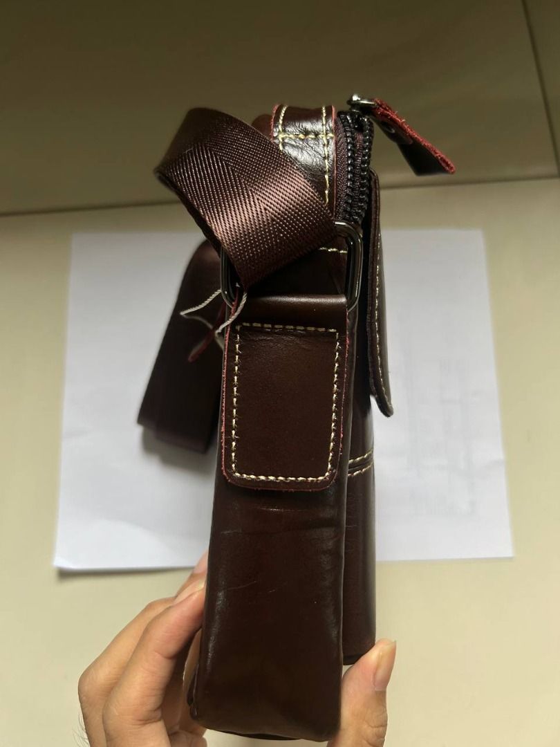 Genuine leather, brown, messenger bag for men (Category: Luxury Bags & Wallets) located in Quezon City. Submitted by daley (Listing ID 1414482144, Image 3). Description: Originally bought from Ali Express, for your reference: https://www.aliexpress.com/item/33032610726.html#nav-specification Genuine leather, brown, messenger bag for men Delivery fee shouldered by the buyer. Available for buyers within Metro Manila only RFS: extra .