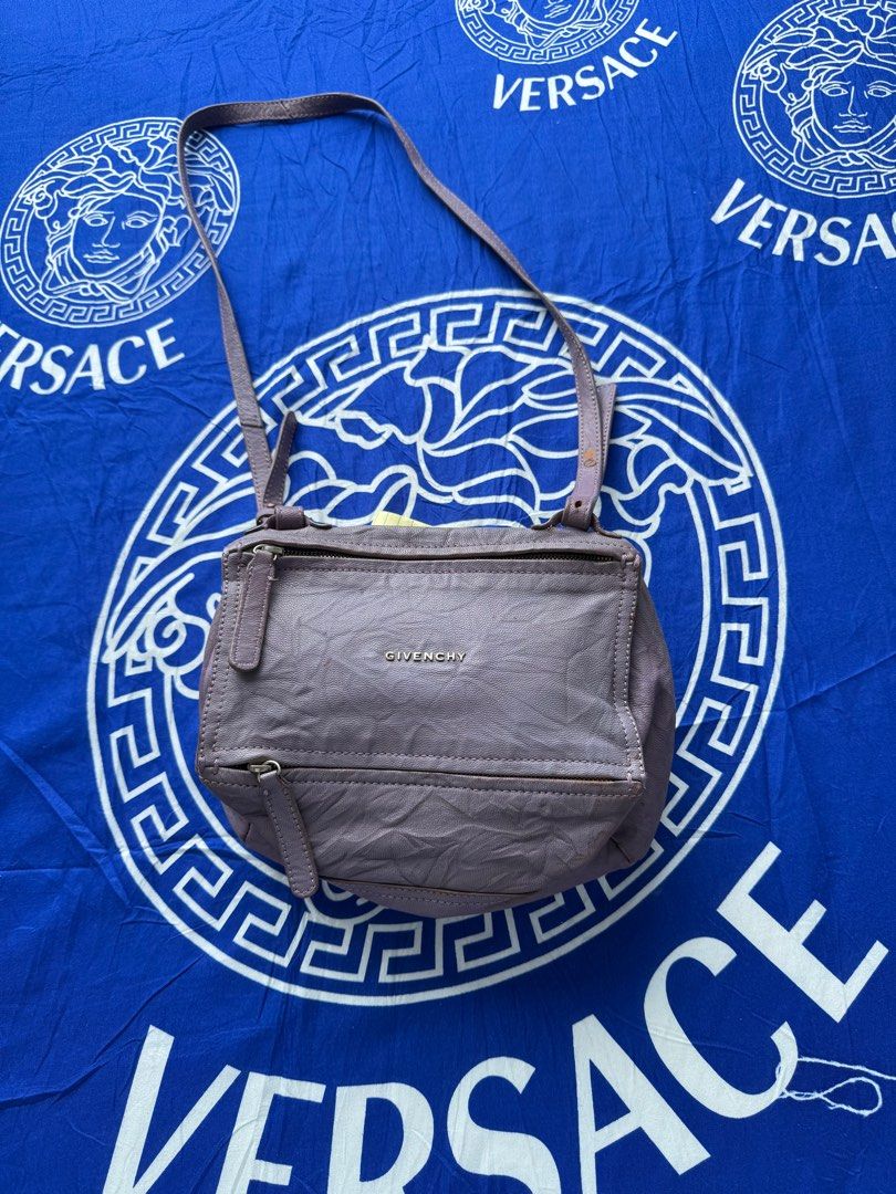 Givenchy Pandora Shoulder Bag (Category: Luxury Bags & Wallets) located in Mandaue City. Submitted by melbafelis47966 (Listing ID 1414507973, Image 1). Description: - Authentic Givenchy Pandora shoulder bag - Color: Lavender - Features: - Top zip closure - Front zip pocket - Shoulder strap - Interior: - Givenchy label - "Made in Italy" tag (ES 0910) - Givenchy logo on front.