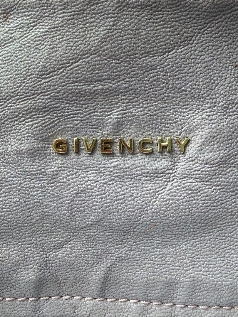 Givenchy Pandora Shoulder Bag (Category: Luxury Bags & Wallets) located in Mandaue City. Submitted by melbafelis47966 (Listing ID 1414507973, Image 3). Description: - Authentic Givenchy Pandora shoulder bag - Color: Lavender - Features: - Top zip closure - Front zip pocket - Shoulder strap - Interior: - Givenchy label - "Made in Italy" tag (ES 0910) - Givenchy logo on front.