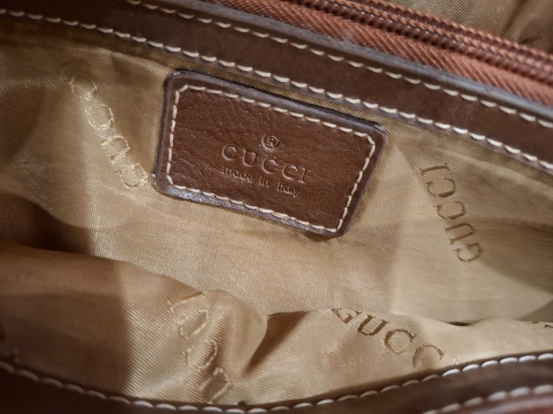 Gucci GG Canvas Tote Bag (Category: Luxury Bags & Wallets) located in Manila. Submitted by warmcat-ee9368 (Listing ID 1414579303, Image 2). Description: - Authentic Gucci tote bag - Iconic GG canvas pattern - Brown leather accents - Braided handle - Light brown fabric lining - Includes Gucci leather tag - Made in Italy - Minor wear on one corner.