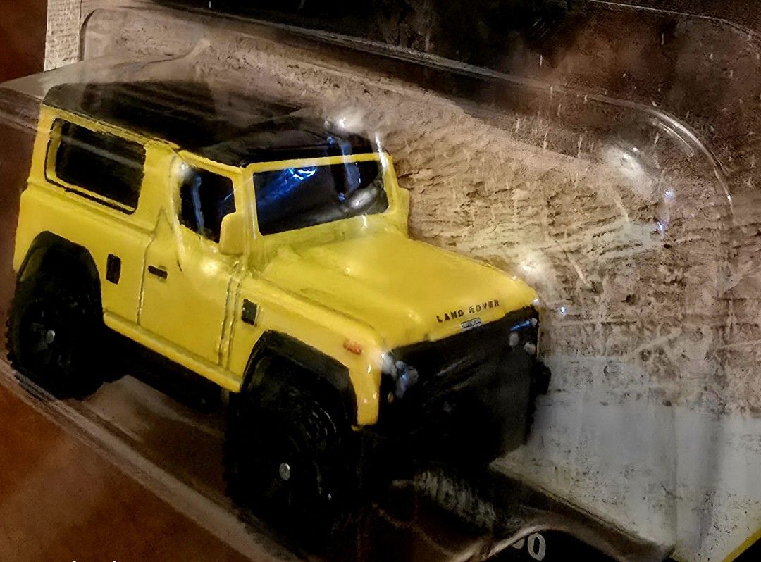 Hot Wheels Premium Land Rover Defender (Category: Vehicle & Diecast Models) located in Manila. Submitted by do_888 (Listing ID 1414502277, Image 3). Description: Hot Wheels Premium Land Rover Defender diecast car. It is part of the Car Culture HW Off-Road series. The car is yellow with a black roof and black wheels. It is a 2/5 model. The packaging is still sealed..