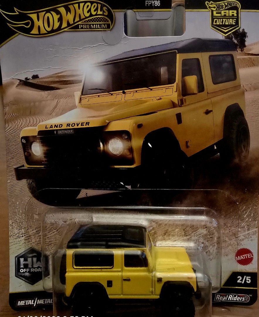 Hot Wheels Premium Land Rover Defender (Category: Vehicle & Diecast Models) located in Manila. Submitted by do_888 (Listing ID 1414502277, Image 1). Description: Hot Wheels Premium Land Rover Defender diecast car. It is part of the Car Culture HW Off-Road series. The car is yellow with a black roof and black wheels. It is a 2/5 model. The packaging is still sealed..